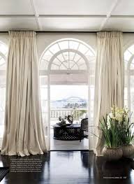 Puddled Drapes And Gorgeous Windows With View Photo By Prue Ruscoe For Vogue L Curtains For Arched Windows Floor To Ceiling Curtains Arched Window Treatments