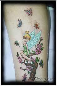 Fairy tattoos have a melancholy appeal for those who retain their childhood affectionately in their hearts and minds. Tinkerbell Tattoo Disney Tattoos Tinker Bell Tattoo Fairy Tattoo