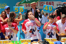 And how many dogs will the winners consume? Coney Island Hot Dog Eating Champ Breaks Record By Downing 6 Dozen Dogs Coney Island New York Dnainfo