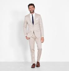 A groom is expected to be wearing something pocket squares are a favourite among men wanting to add a pop of colour to their suits. Tan Suit The Black Tux
