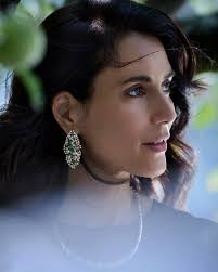 She carries the stories of her renewal with grace; alive with nature's  rhythm, balanced in form and design. Each creation crafted to mirror her  essence