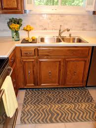 Kitchen with white cabinets and full height marble slab backsplash by island architects. How To Install A Marble Tile Backsplash Hgtv