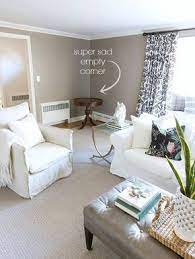 Modern room, blue wall, wooden desk and desktop room corner, sofa, frame carpet and furniture decor with lamp. Bye Bye Bench Hello Homegoods Finds Filling An Empty Corner Ikea Slipcover Amazingness Driven By Decor Living Room Corner Living Room Empty Living Room Corner Decor