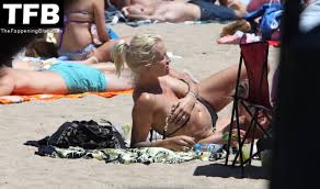 Sarah Connor Flashes Her Nude Breasts on the Beach