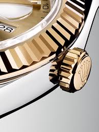 When this is done, you will feel the tension on the crown and hear a subtle clicking as it turns. The 18ct Yellow Gold Winding Crown Of A Datejust 41 In Rolesor Version Luxury Watches For Men Rolex Watches Rose Gold Rolex Mens