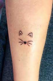 A Cat Tattoos Guide To Help You Choose Cat Tattoo Simple Cat Tattoo Designs Minimalist Tattoo