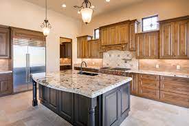 Prep, prime, and paint the doors, drawers, and shelves. Design Your Kitchen With Wood Stained Cabinets And An Accent Painted Island Like This One Stained Kitchen Cabinets Custom Kitchen Cabinets Design Your Kitchen