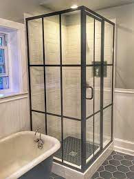 Bronze Framed Glass Shower Enclosure This Is A Bit Of A Throwback To Yesterday S Design But Many People Sti Shower Doors Framed Shower Door Shower Enclosure