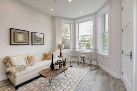 An accent wall is a great way to break up a space, especially in a living room with high ceilings. 4 Ways To Style A Room With White Walls