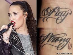 Born under the sign of leo, the singer demi lovato has a lion's face tattooed on her right hand. Demi Lovato S Tattoos Meanings Steal Her Style