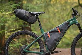 porcelain rocket albert dropper seat post seat pack kona bikes bikepacking kona