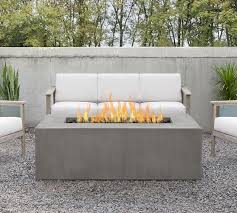 A fire pit table is often a standard size table with a fire pit inserted in the middle. Abbott Concrete 60 X 30 Rectangular Propane Fire Pit Table Pottery Barn