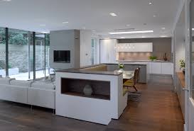 The open concept of the living zones in modern architecture and design places the modern kitchen into the center of the decor composition. Open Plan Or Broken Plan