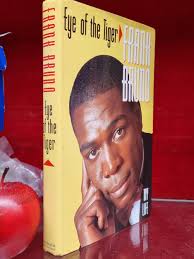 A signed edition of "Eye of the Tiger" by Frank Bruno, accompanied by a  signed picture by Frank Brun