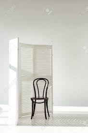 Get inspired with our curated ideas for products and find the perfect item for every room in your home. Dark Wooden Chair And White Room Divider With Shadows And Sunlight Stock Photo Picture And Royalty Free Image Image 116323274