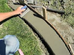 Mark the edges of the new flower bed edger, using a hose, rope or spray paint. 17 Awesome Diy Concrete Garden Projects The Garden Glove Concrete Garden Concrete Landscape Edging Lawn Borders