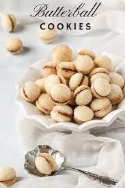 Spritz cookies are a christmas classic that have been gracing our holiday tables for generations. Easy To Make Butterball Cookies They Re Sandwiched Together With Raspberry Jam And Rolled In Aromatic Butterball Cookies Yummy Cookies Italian Cookie Recipes