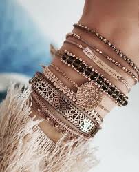 Slide the open jump ring with the charm into the right link on the bracelet. A Guide To Choosing Styling Your Charm Bracelets The Fashion Tag Blog