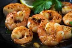 What is the best way to reheat cooked shrimp?