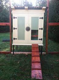 To see photos of the project being built, visit backyard chickens. My Chicken Coop Made From An Old Tv Cabinet And The Nesting Box Is From An Old Kitchen Cabinet Old Cabinets Chicken Coop Backyard Landscaping Designs
