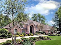 Here are our top ten low maintenance landscaping ideas for beach homes day lily How To Choose The Best Plants For Low Maintenance Curb Appeal Curb Appeal Cool Plants Beautiful Front Doors