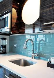 I Like The Countertop And Tile And The Darkness Of The Cabinets But Not The Cabinets Sky Blue Glass Tile Kitchen Blue Backsplash Blue Glass Tile Backsplash