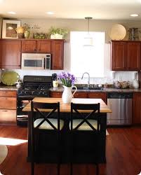 As ivy climbs up a living room wall or a vase of flowers sits perched in a kitchen windowsill, plants can bring a room to life. 37 Above Kitchen Cabinets Ideas