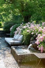 Backyard Garden Ideas Lush Flowers Tranquil Waterfall Perfect For A Little Meditation And Zen Water Features In The Garden Outdoor Gardens Garden Fountains