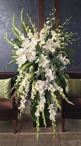 Funeral flower arrangements are a way to honor the deceased and provide a measure of comfort for the family. Standing Sprays For Funerals And Memorials Really Make A Beautiful Statement Funeral Floral Arrangements Large Flower Arrangements Funeral Flower Arrangements