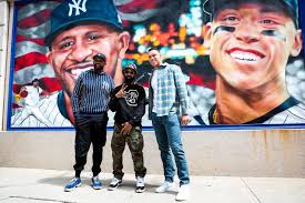 Today, The Bronx Children's Museum & The Players Alliance, in collaboration  with the Yankees, unveiled “Exhibiting Possibilities: Legendary Yankees," a  series of outdoor murals located at Bronx Terminal Market. Bronx-born  muralist André