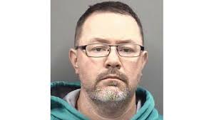 Report: Man arrested after woman walks in