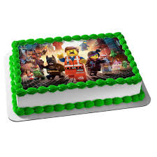 All you need is a boxed cake mix (i made funfetti cupcakes), some buttercream frosting (here's my fave recipe ), and some lego candies. Lego Movie Batman Emmet Lucy Green Lantern Wonder Woman Rex Edible Cake Topper Image Abpid03660 Walmart Com Walmart Com