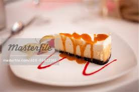 600 05822165em Cheesecake With Caramel Sauce On Plate Stock Photo Jpg 450 299 Pixels Cheesecake Desserts Caramel