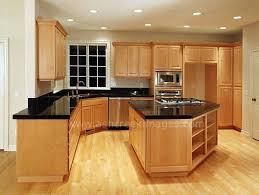 Black Counter Tops And Wood Floors With The Light Cabinets Is What We Are Wanting In Our Kitchen Maple Kitchen Cabinets Maple Kitchen Black Countertops