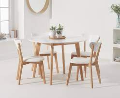 Design of round dining room table size, that can extend out what size calculator if you want to ten guests or as many as for each guest. Rebekah White And Oak 110cm Round Dining Table With Rebekah Faux Leather Dining Chairs