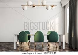The example provides for you another easy yet important idea. White Dining Room And Kitchen Interior With A Dark Wooden Floor White Walls Large Windows With Curtains And A Table With Green Chairs A Front View 3d Rendering Mock Up Poster Id 238538041