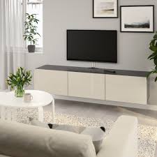 besta tv unit with doors black brown selsviken high gloss beige 70 7 8x16 1 2x15 buy online or in store ikea in 2021 tv bench ikea wall mounted tv unit
