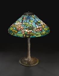 Tiffany Studios A Fine And Rare Pond Lily Table Lamp With A Rare Water Lily Twisted Stem Base Tiffany Inspired Lamps Tiffany Style Lamp Tiffany Lamps