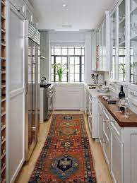 Tribal Rug Pops In Traditional White Kitchen Galley Kitchen Design Kitchen Design Small Small Galley Kitchens
