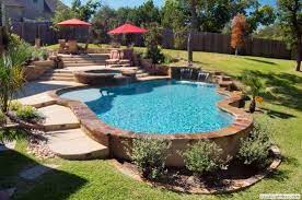 Pools Built On A Slope Pool Ideas Like The Stone Surround Built On Slope Backyard Pool Landscaping Landscaping Around Pool Pool Landscaping