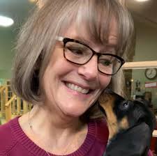 Orange and blue bus with custom cut job