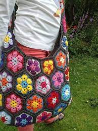 In this case, they are used at the center of the flower to add texture. African Flower Shoulder Bag Crochet African Flowers Shoulder Bags Pattern Bag Pattern