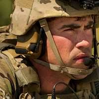 US Navy Lieutenant Eric Percival (left), USN Lieutenant Jeff Naven  (center), and USN Lieutenant Junior Grade Budd Bergloff (right), assigned  to Navy Fighter Squadron 31 (VF 31), Carrier Air Wing One Four (
