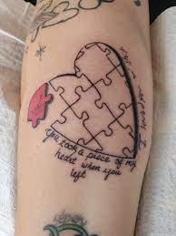 Small puzzle piece heart tattoo on wrist. Tattoo Uploaded By Robert Martin Puzzle Piece With Half A Heart 493577 Tattoodo