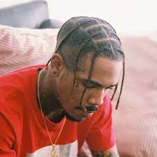 Most of his braids are in a loose ponytail to keep them out of his face during performance. 25 Asap Rocky Braids Styles Asap Rocky Braids Mens Braids Hairstyles Hair Styles Braids With Fade