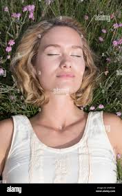 Woman contemplating smile hi-res stock photography and images