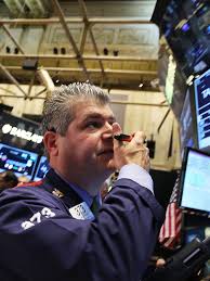 Dow loses 108, back in the red for 2015