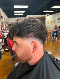 Mandy, our owner with over 26 years of experience in the art of barbering!  Known for her talent, leadership, and unwavering dedication to our  barbershop and clients, Mandy is the heart and
