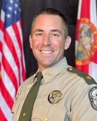 Major Bill Holcomb grew up in Tampa, Florida, spending much of his time  fishing and enjoying the outdoors. He attended Eckerd Co