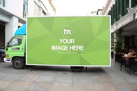 A Large Billboard Advertisement On The Side Of A Truck In The Middle Of A Busy Street Display Your Urban Advertisement Idea Or Pr Mockup Ad Design Advertising